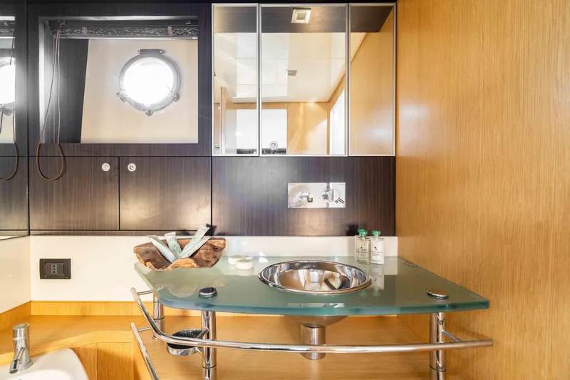  Yacht Photos Pics Luxurious bathroom interior of 2009 Riva 63 Vertigo yacht with modern fixtures.