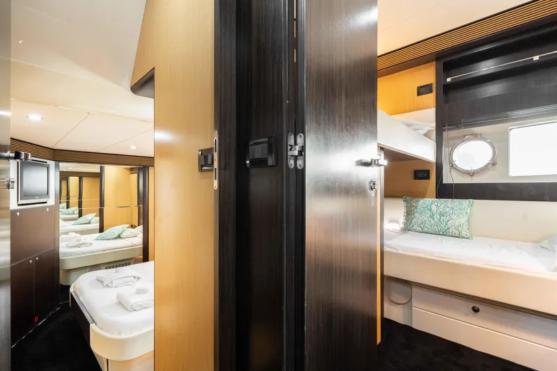  Yacht Photos Pics Interior of 2009 Riva 63 Vertigo yacht, featuring luxurious cabins and modern design elements.