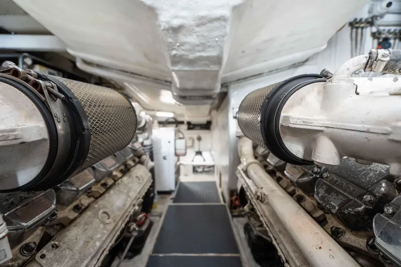  Yacht Photos Pics Engine room of 2009 Riva 63 Vertigo yacht, showcasing dual engines and mechanical components.