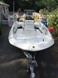 2017 Bayliner Element F18 CC boat on trailer in driveway.