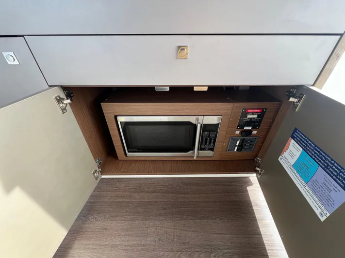  Yacht Photos Pics Microwave inside a Beneteau Antares 9 yacht cabinet, 2020 model.