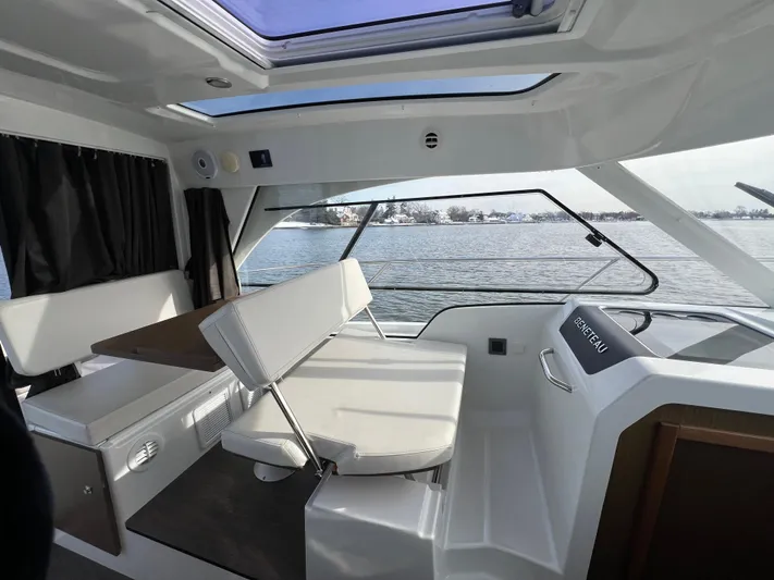  Yacht Photos Pics Interior of 2020 Beneteau Antares 9 boat with seating and water view.