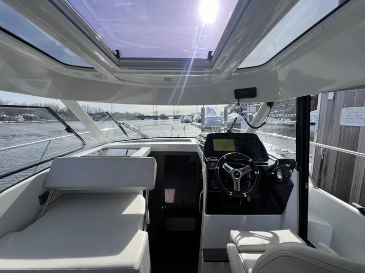  Yacht Photos Pics Interior view of 2020 Beneteau Antares 9 boat with modern cockpit and seating.