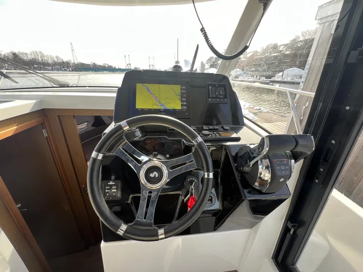  Yacht Photos Pics Helm of 2020 Beneteau Antares 9 with navigation system and steering wheel.