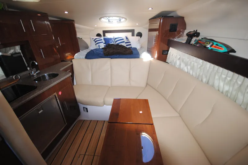  Yacht Photos Pics Luxurious interior of 2015 Regal 32 Express yacht with cozy seating and modern amenities.