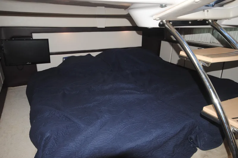  Yacht Photos Pics Interior cabin of 2015 Regal 32 Express with bed and TV.