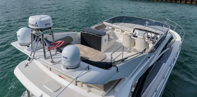  Yacht Photos Pics 2017 Absolute 50 Fly yacht with spacious deck and modern navigation equipment on the water.