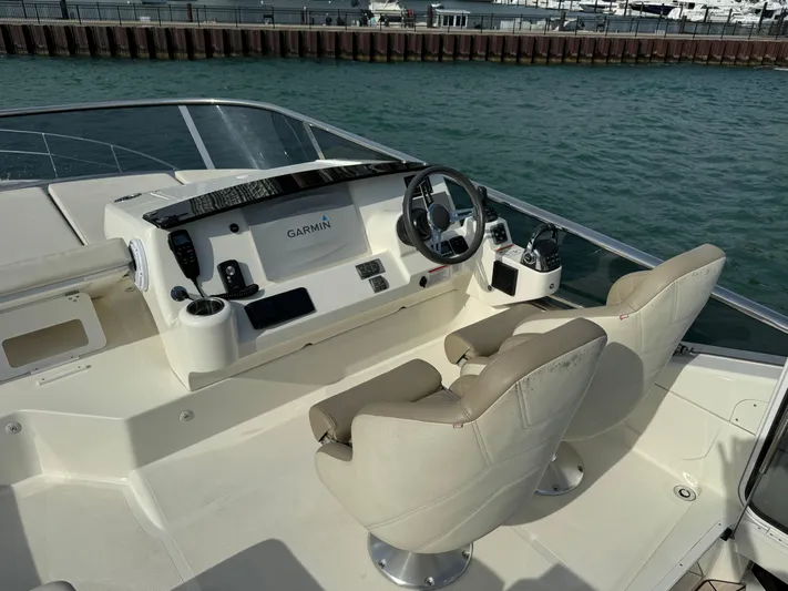  Yacht Photos Pics Flybridge helm of 2017 Absolute 50 Fly yacht with Garmin navigation system.