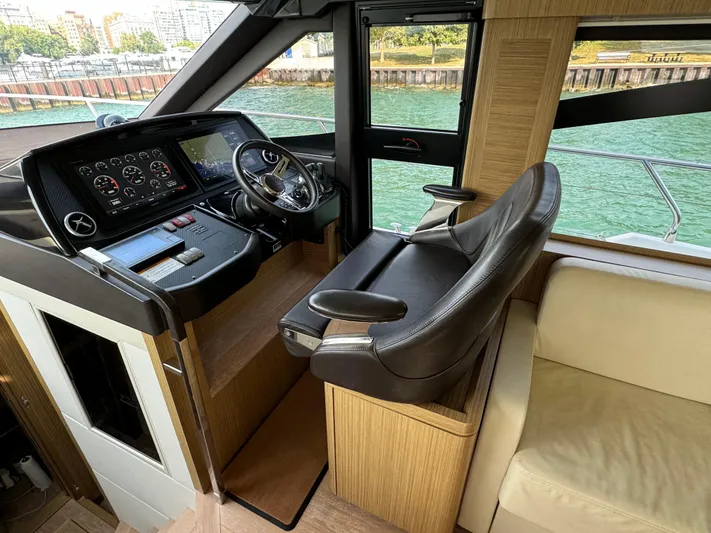  Yacht Photos Pics Luxurious helm of 2017 Absolute 50 Fly yacht with modern controls and leather seating.