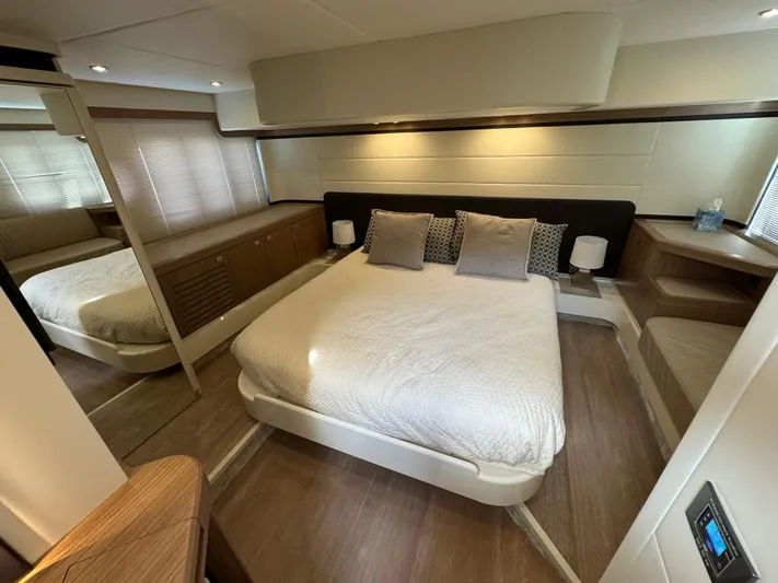  Yacht Photos Pics Luxurious bedroom interior of 2017 Absolute 50 Fly yacht with modern decor and cozy bedding.