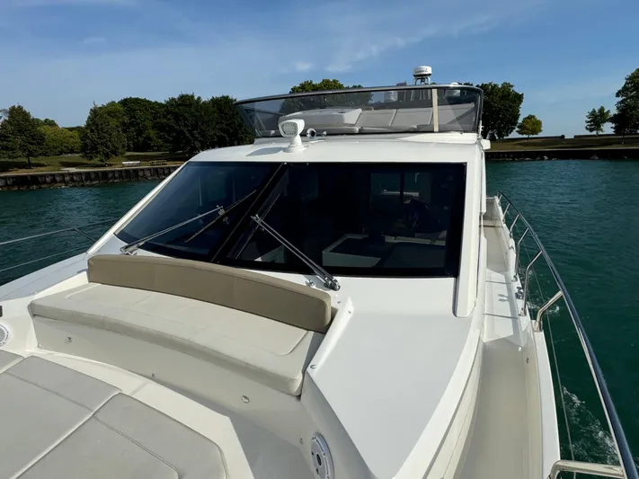  Yacht Photos Pics 2017 Absolute 50 Fly yacht on water, featuring sleek design and spacious deck.