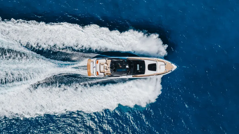Kiyomizu Yacht Photos Pics Aerial view of 2020 Riva 90 Argo yacht cruising on blue ocean waters.