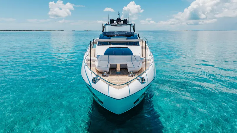 Kiyomizu Yacht Photos Pics Luxurious 2020 Riva 90 Argo yacht on clear turquoise waters under a bright blue sky.