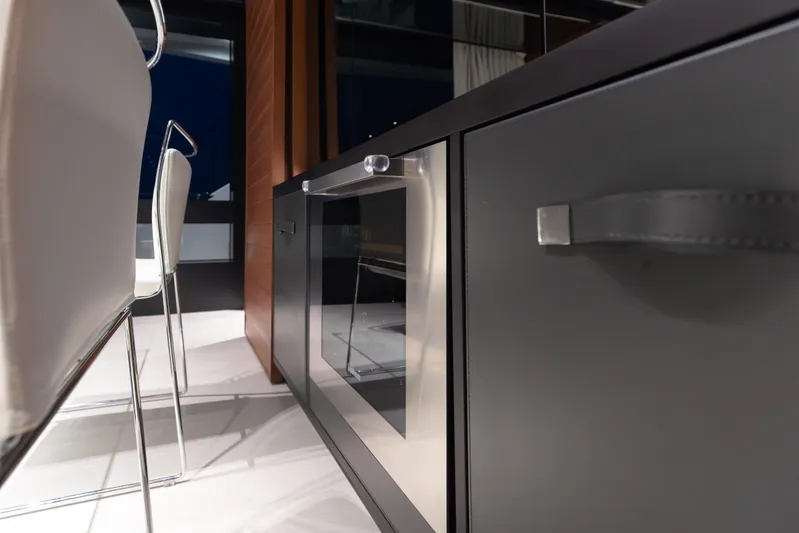 Kiyomizu Yacht Photos Pics Modern interior of Riva 90 Argo yacht, featuring sleek cabinetry and elegant seating, 2020 model.