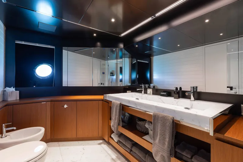Kiyomizu Yacht Photos Pics Luxurious bathroom on 2020 Riva 90 Argo yacht with modern fixtures and elegant design.