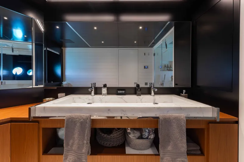 Kiyomizu Yacht Photos Pics Luxurious bathroom on 2020 Riva 90 Argo yacht with marble sink and modern fixtures.