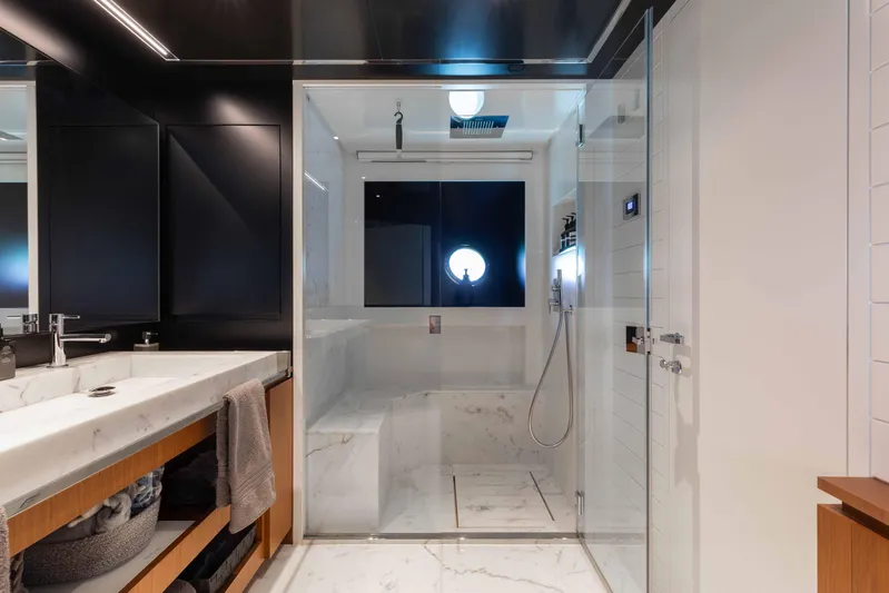 Kiyomizu Yacht Photos Pics Luxurious bathroom on 2020 Riva 90 Argo yacht with marble shower and modern fixtures.
