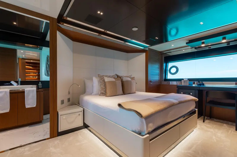 Kiyomizu Yacht Photos Pics Luxurious bedroom interior on 2020 Riva 90 Argo yacht, featuring modern design and ocean view.