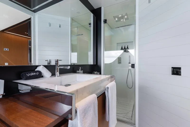 Kiyomizu Yacht Photos Pics Luxurious bathroom on 2020 Riva 90 Argo yacht with modern fixtures and elegant design.