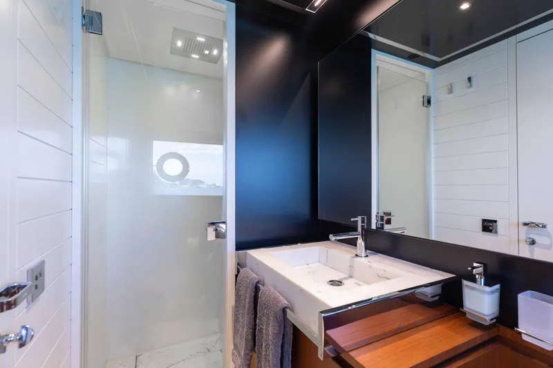 Kiyomizu Yacht Photos Pics Luxurious bathroom interior on 2020 Riva 90 Argo yacht, featuring modern sink and shower.