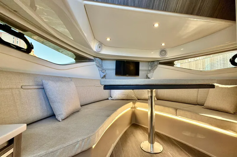  Yacht Photos Pics Luxurious interior of 2022 Sea Ray Sundancer 320 yacht with elegant seating and modern lighting.