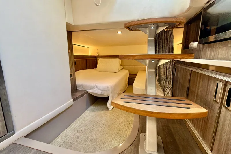  Yacht Photos Pics Luxurious interior of 2022 Sea Ray Sundancer 320 yacht with cozy bedroom and modern design.