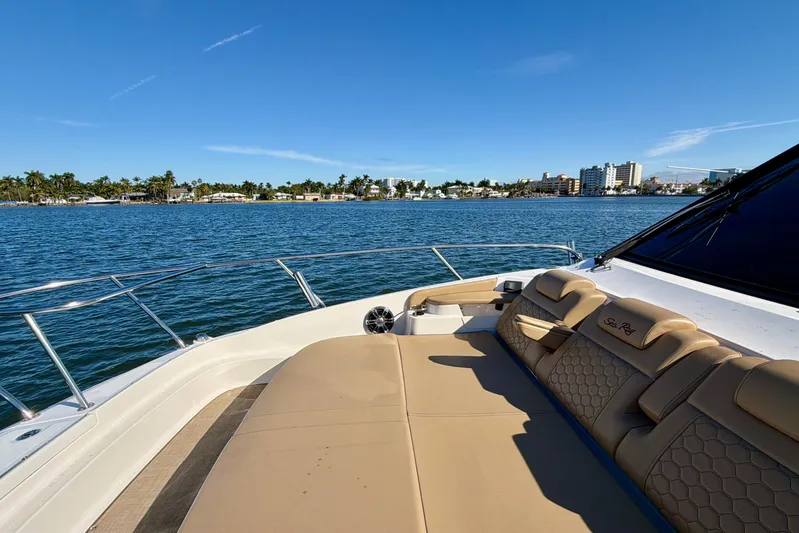  Yacht Photos Pics 2022 Sea Ray Sundancer 320 yacht with luxurious seating, cruising on a sunny day.