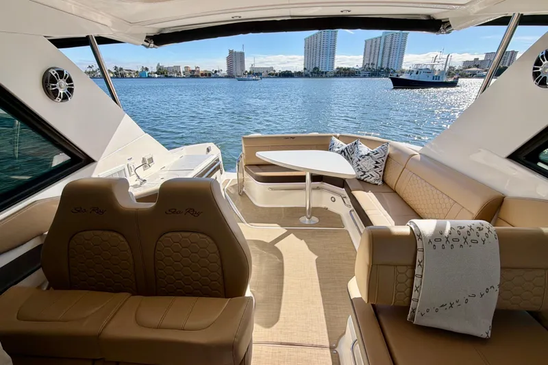  Yacht Photos Pics Luxurious 2022 Sea Ray Sundancer 320 interior with waterfront view and elegant seating.