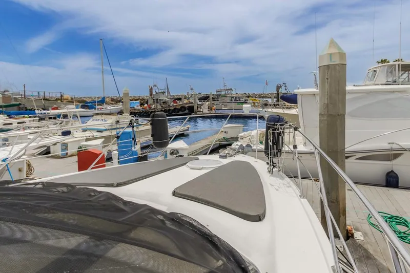 Aloha Ke Akua Yacht Photos Pics 2007 Carver 42 Super Sport yacht docked in a marina under a clear blue sky.