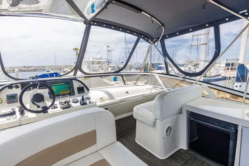 Aloha Ke Akua Yacht Photos Pics Interior view of 2007 Carver 42 Super Sport yacht with helm and seating area.