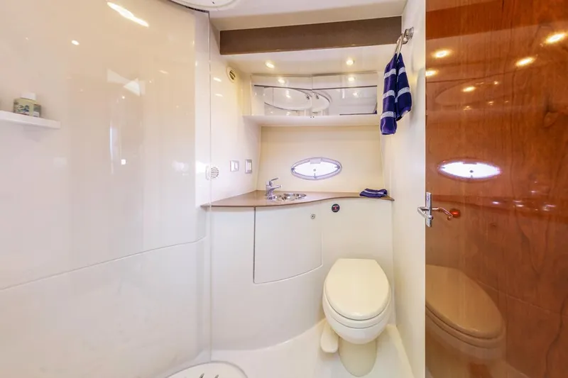 Aloha Ke Akua Yacht Photos Pics 2007 Carver 42 Super Sport yacht bathroom with modern fixtures and wooden accents.