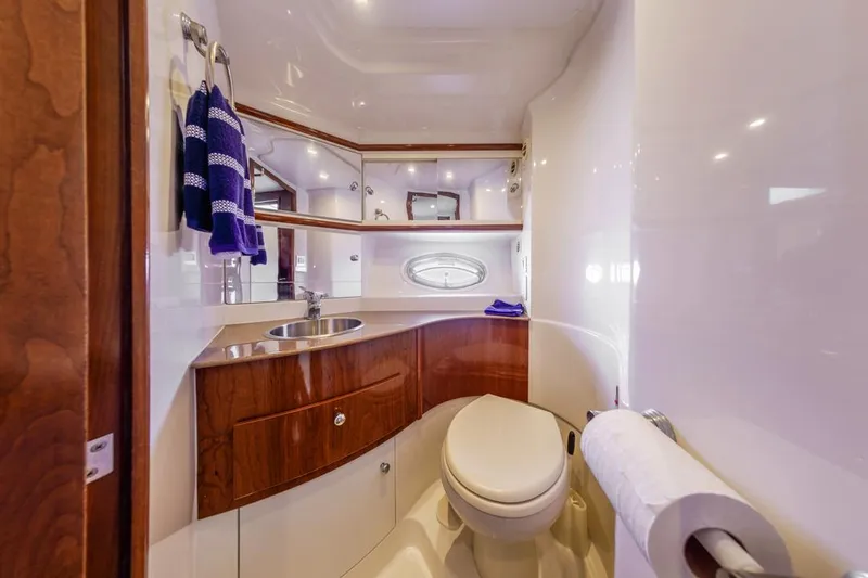Aloha Ke Akua Yacht Photos Pics Luxurious bathroom in 2007 Carver 42 Super Sport yacht with wood accents and modern fixtures.