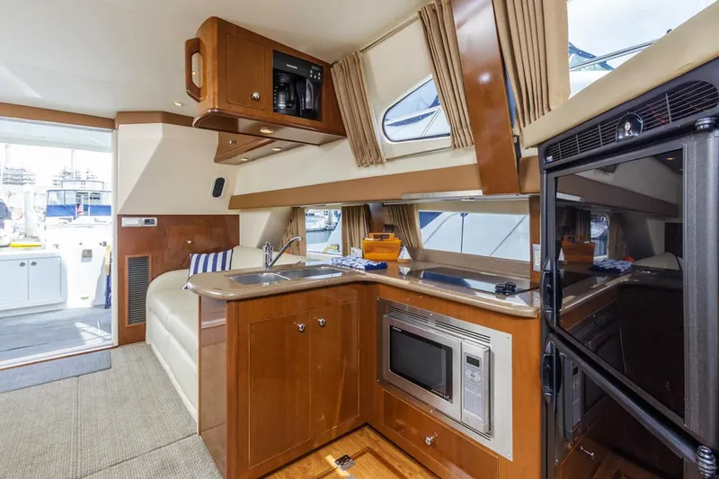 Aloha Ke Akua Yacht Photos Pics Interior of 2007 Carver 42 Super Sport yacht with modern kitchen amenities.