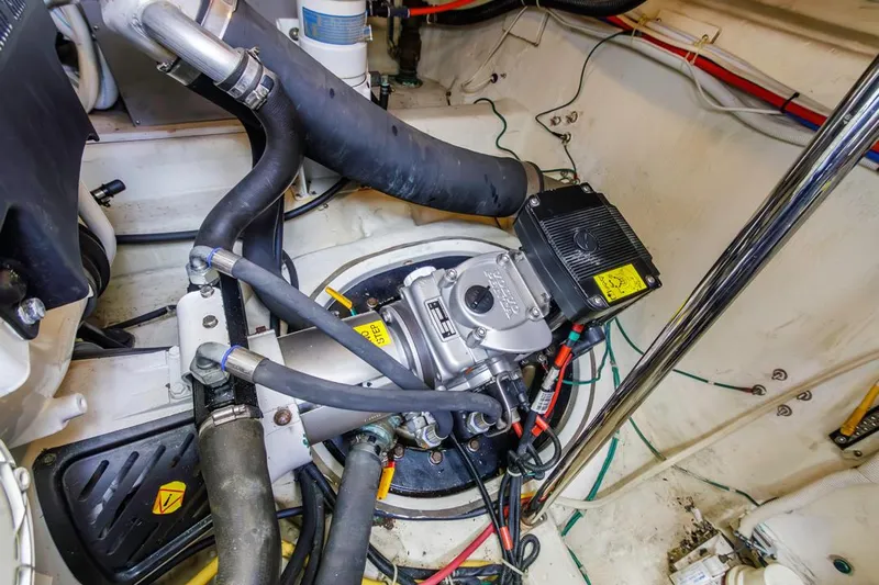 Aloha Ke Akua Yacht Photos Pics Engine compartment of a 2007 Carver 42 Super Sport boat, showcasing mechanical components and wiring.