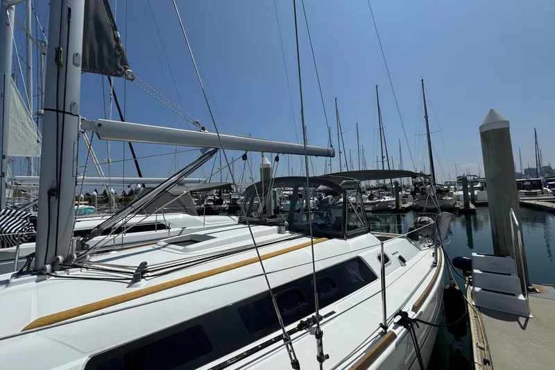 Mi Fuego Yacht Photos Pics 2017 Beneteau Oceanis 37 sailboat docked at marina under clear blue sky.