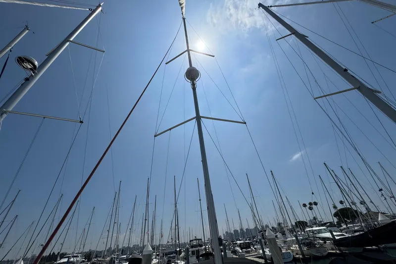 Mi Fuego Yacht Photos Pics Masts of Beneteau Oceanis 37 sailboats in a sunny marina, 2017 model.