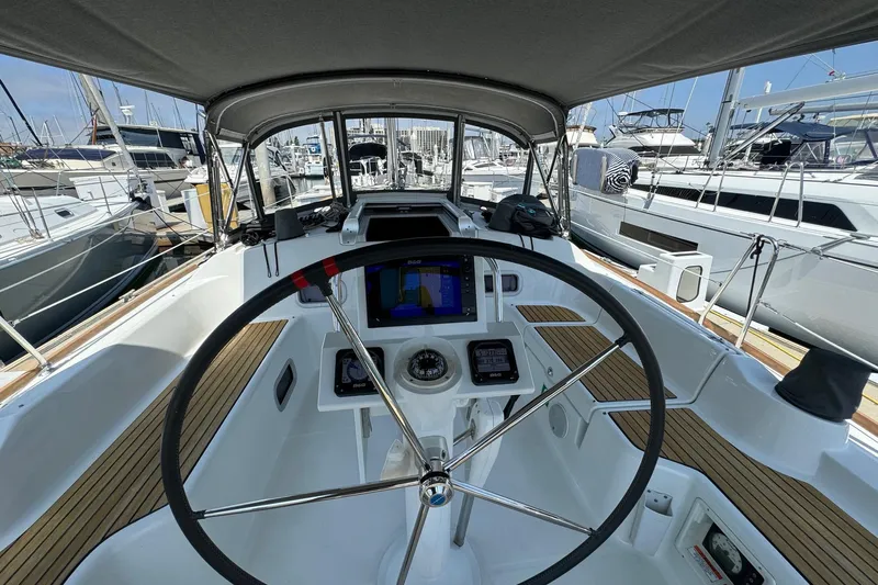 Mi Fuego Yacht Photos Pics Cockpit view of 2017 Beneteau Oceanis 37 sailboat with steering wheel and navigation instruments.