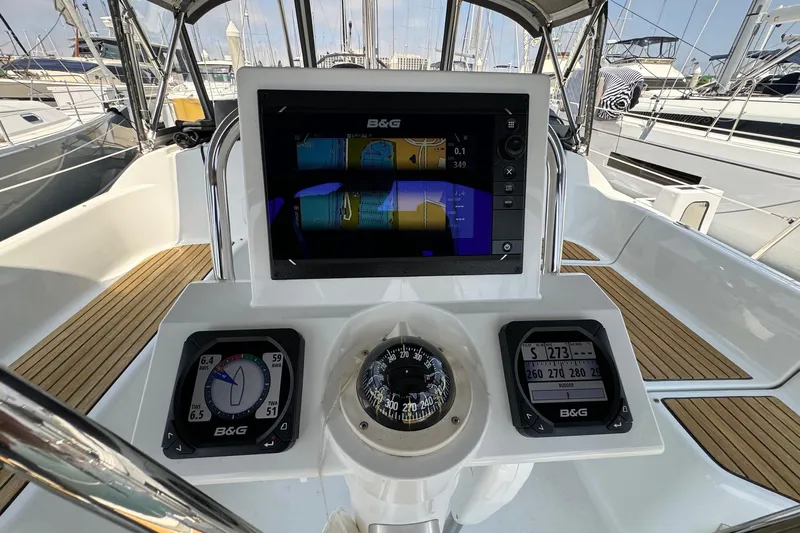 Mi Fuego Yacht Photos Pics Cockpit of 2017 Beneteau Oceanis 37 sailboat with navigation instruments and compass.