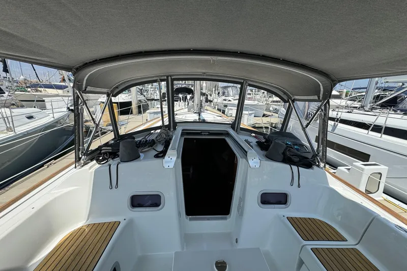 Mi Fuego Yacht Photos Pics 2017 Beneteau Oceanis 37 sailboat cockpit with canopy, docked at marina.