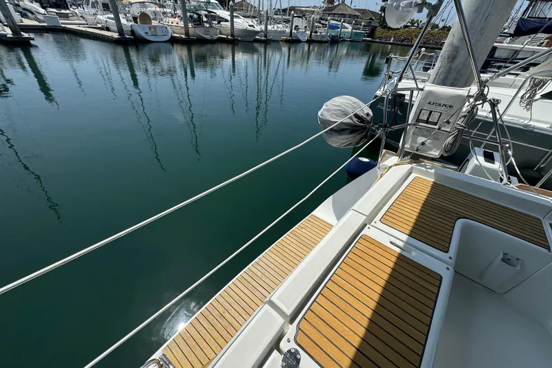 Mi Fuego Yacht Photos Pics Beneteau Oceanis 37 sailboat deck, 2017 model, docked at a marina.
