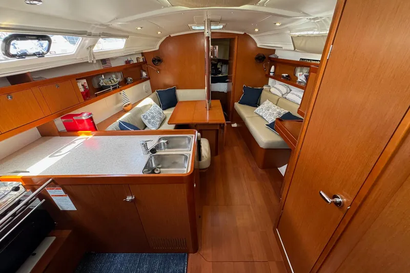 Mi Fuego Yacht Photos Pics Interior of 2017 Beneteau Oceanis 37 yacht with cozy seating and modern kitchen area.