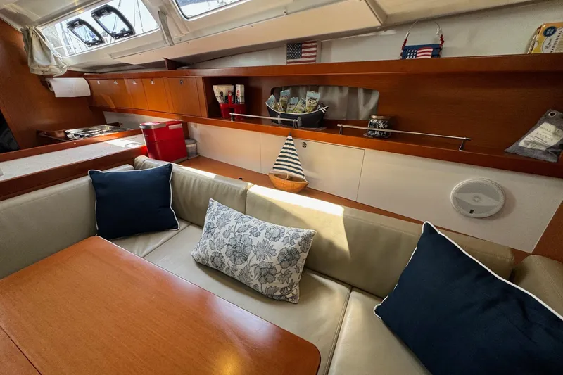 Mi Fuego Yacht Photos Pics Interior of 2017 Beneteau Oceanis 37 yacht with cozy seating and nautical decor.