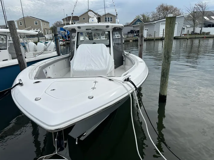  Yacht Photos Pics 2023 Everglades 395 Center Console boat docked in a marina.