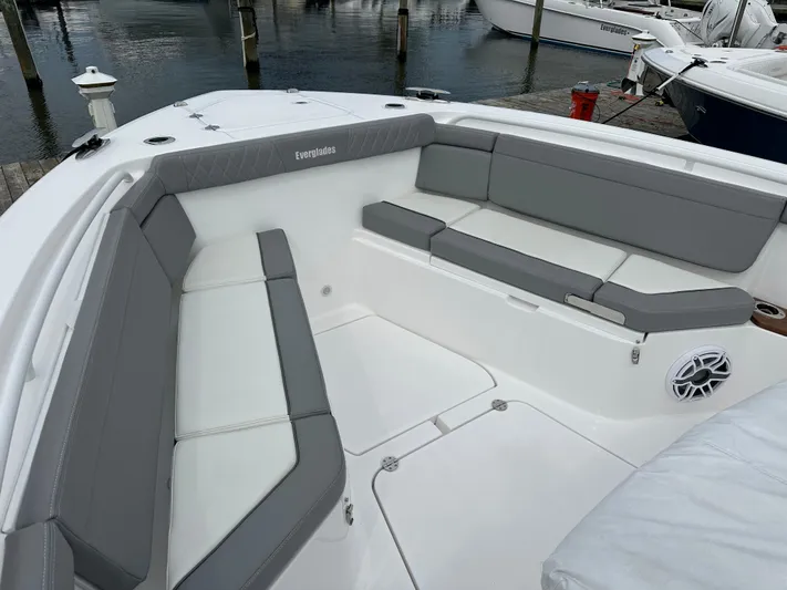  Yacht Photos Pics 2023 Everglades 395 Center Console boat with spacious seating area at the dock.