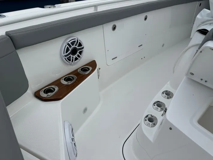  Yacht Photos Pics 2023 Everglades 395 Center Console boat interior with cup holders and speaker.
