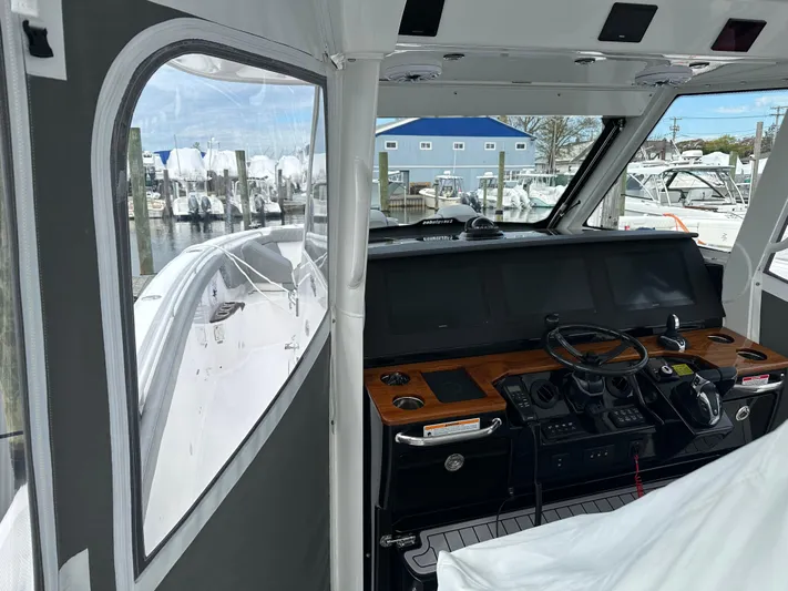  Yacht Photos Pics 2023 Everglades 395 Center Console boat interior with advanced navigation system.
