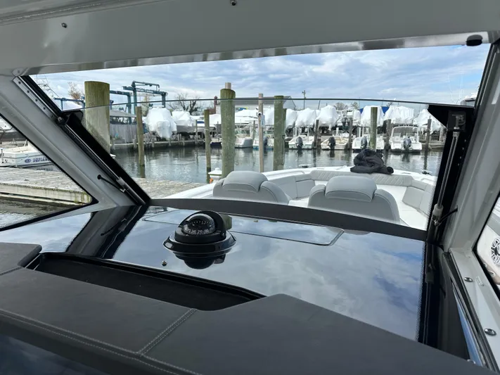  Yacht Photos Pics 2023 Everglades 395 Center Console boat interior view at marina.