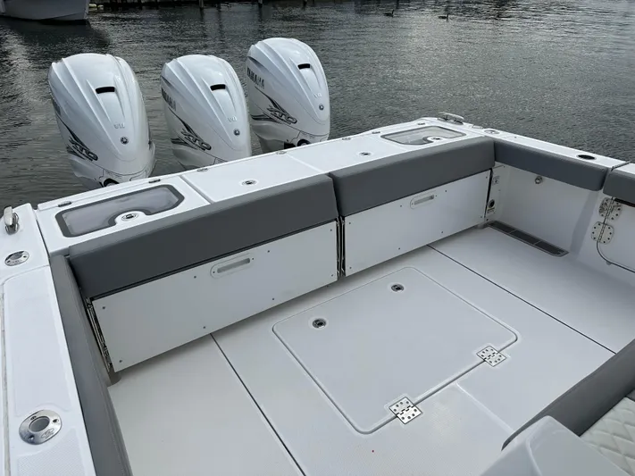  Yacht Photos Pics 2023 Everglades 395 Center Console boat with triple outboard engines.