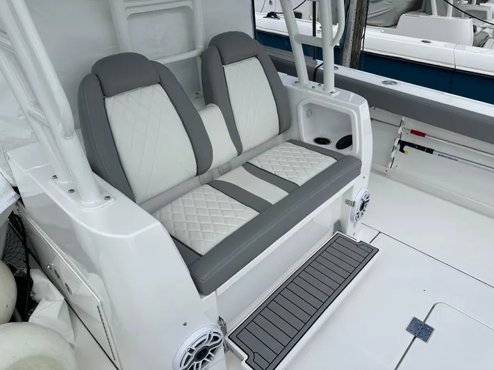  Yacht Photos Pics 2023 Everglades 395 Center Console boat with cushioned seating and modern design.