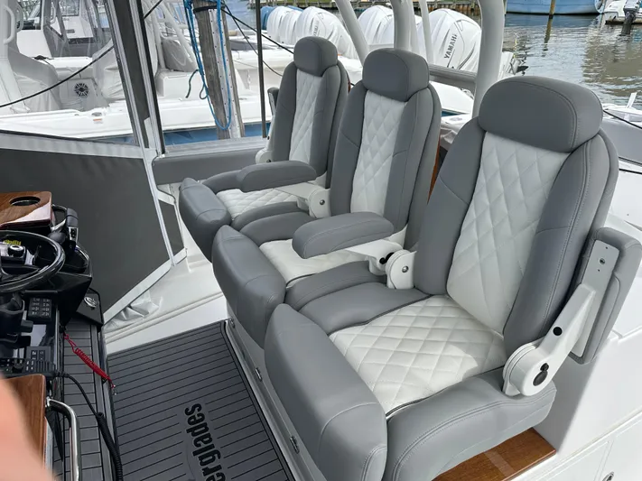  Yacht Photos Pics 2023 Everglades 395 Center Console boat with luxurious gray and white seating.